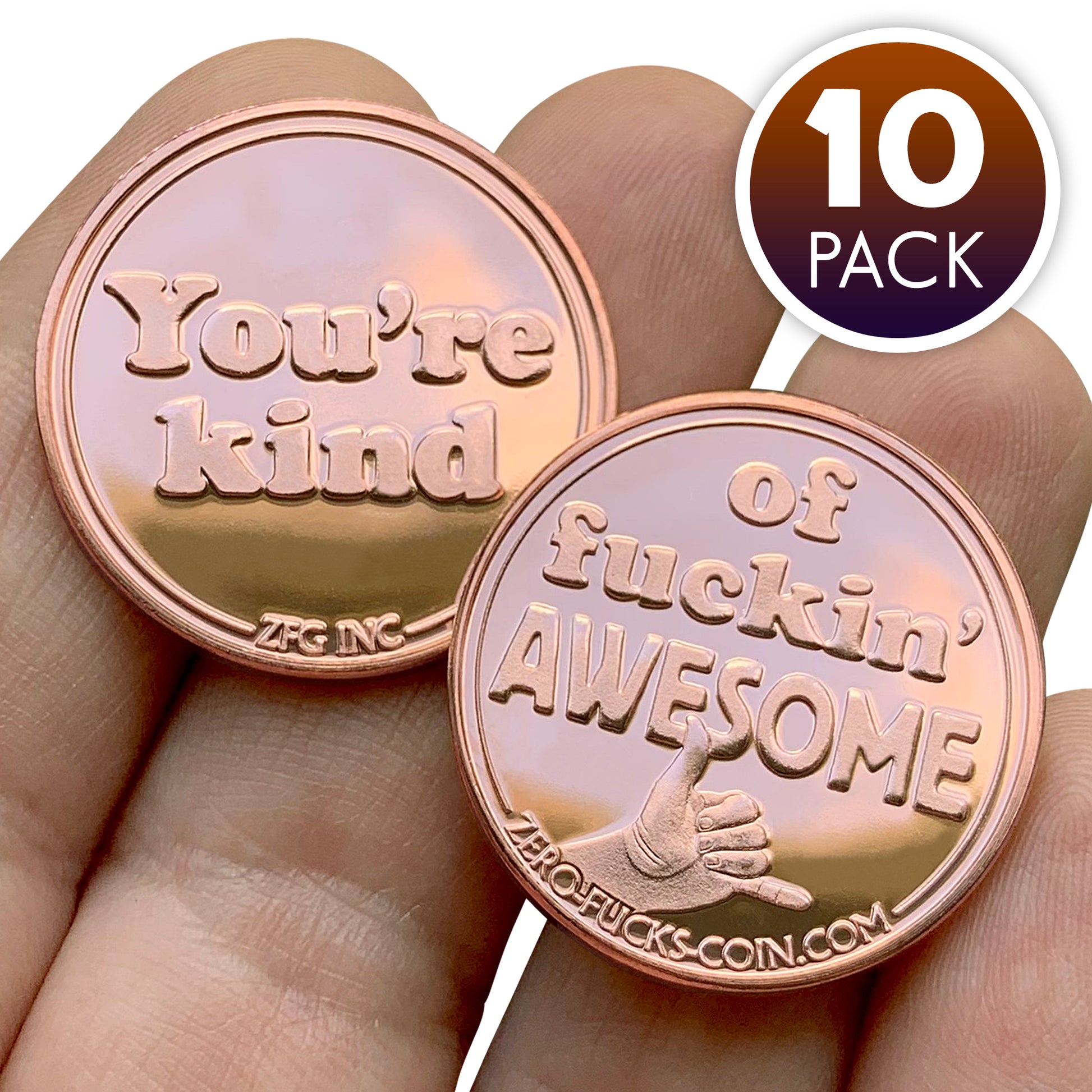 Two copper you're kind of awesome coins with motivational text held in a hand, labeled '10 Pack'.