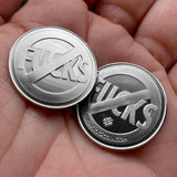 Two "No" Symbol "Fucks" coins in hand