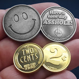 smiley face coin and 2 cents coins in hand