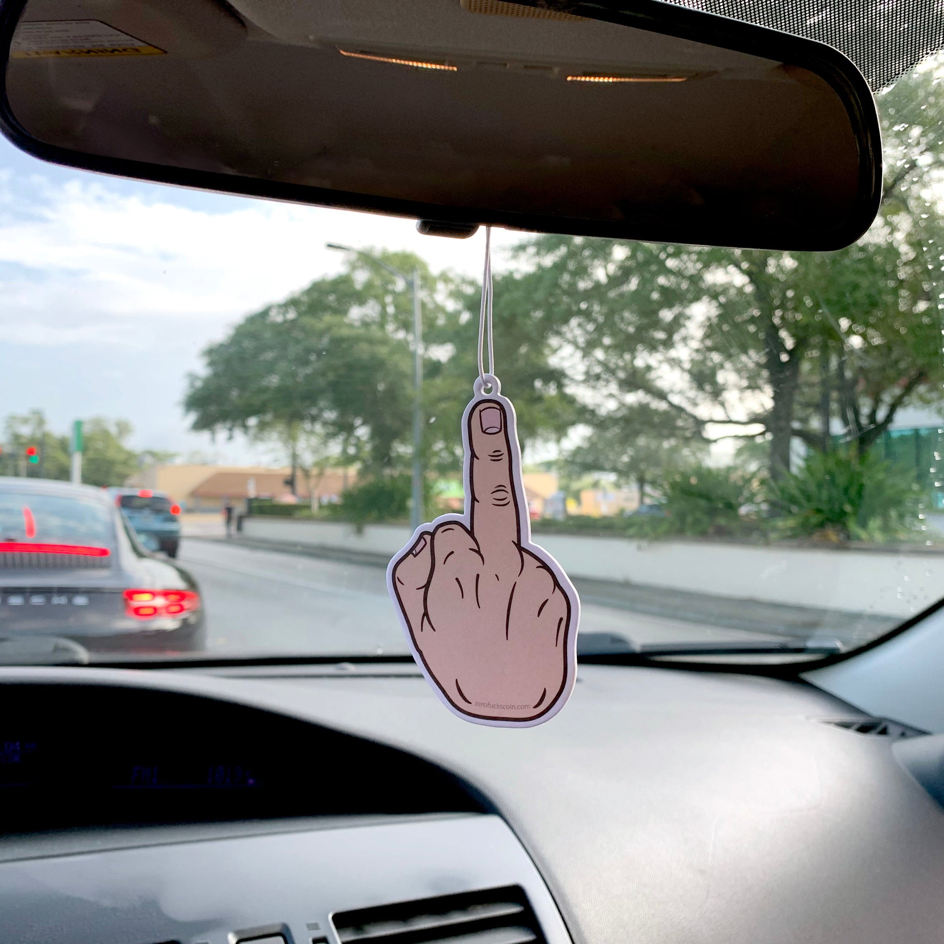 flipping the bird air freshener - middle finger - in car