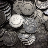 middle finger coins, stack of coins, smiley face coins