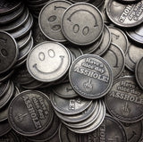 stack of asshole middle finger coins, have a nice day asshole